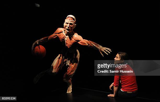 Guest views an exhibit at Gunther von Hagens' 'Body Worlds And The Mirror Of Time' exhibition at the O2 bubble on October 23, 2008 in London,...