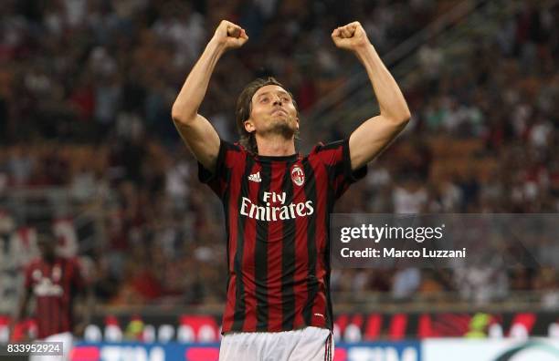 Riccardo Montolivo of AC Milan celebrates his second goal during the UEFA Europa League Qualifying Play-Offs round first leg match between AC Milan...