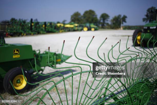 Deere & Co. John Deere farm machinery sit on display for sale at the Smith Implements Inc. Dealership in Greensburg, Indiana, U.S., on Wednesday,...