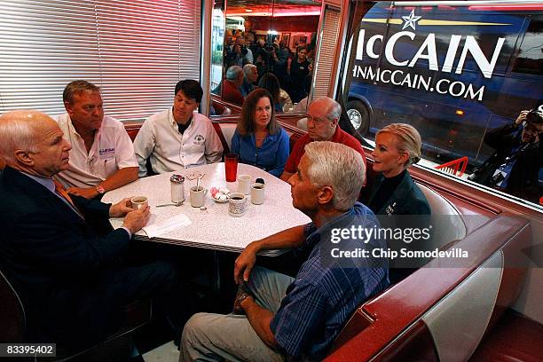 Republican presidential nominee Sen. John McCain has coffee with small business owners Tom Crowe, Tim Curtis, Patricia Surguine, Richard Rivers, his...
