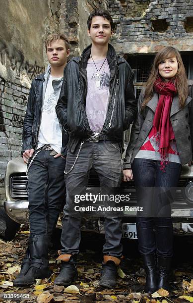 Actor Wilson Gonzalez Ochsenknecht, actor Jimi Blue Ochsenknecht and actress Emilia Schuele and pose in front of a car during a photocall to the...