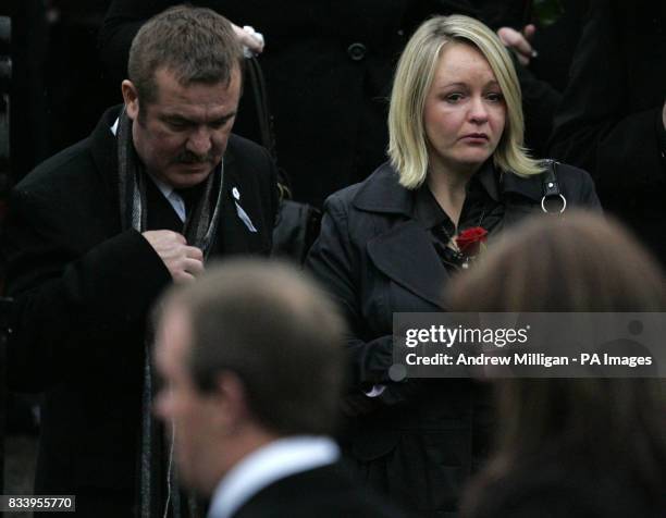 Sharon Brown, Vicky Hamilton's sister, holds a rose outside Redding Parish Church in Redding, near Falkirk, after the funeral of schoolgirl Vicky...