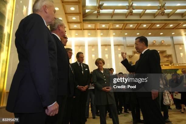 German Chancellor Angela Merkel and Chinese Premier Wen Jiabao talk to German entrepreneur's at the Great Hall of the People on October 23, 2008 in...