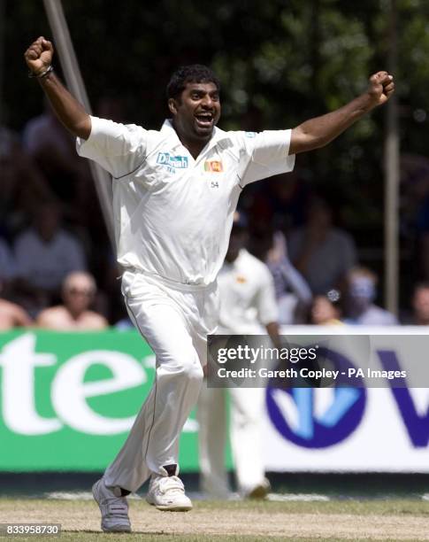 Muttiah Muralitharan celebrates dismissing England's Paul Collingwood to become Test cricket's leading wicket-taker with 709 wickets during the first...