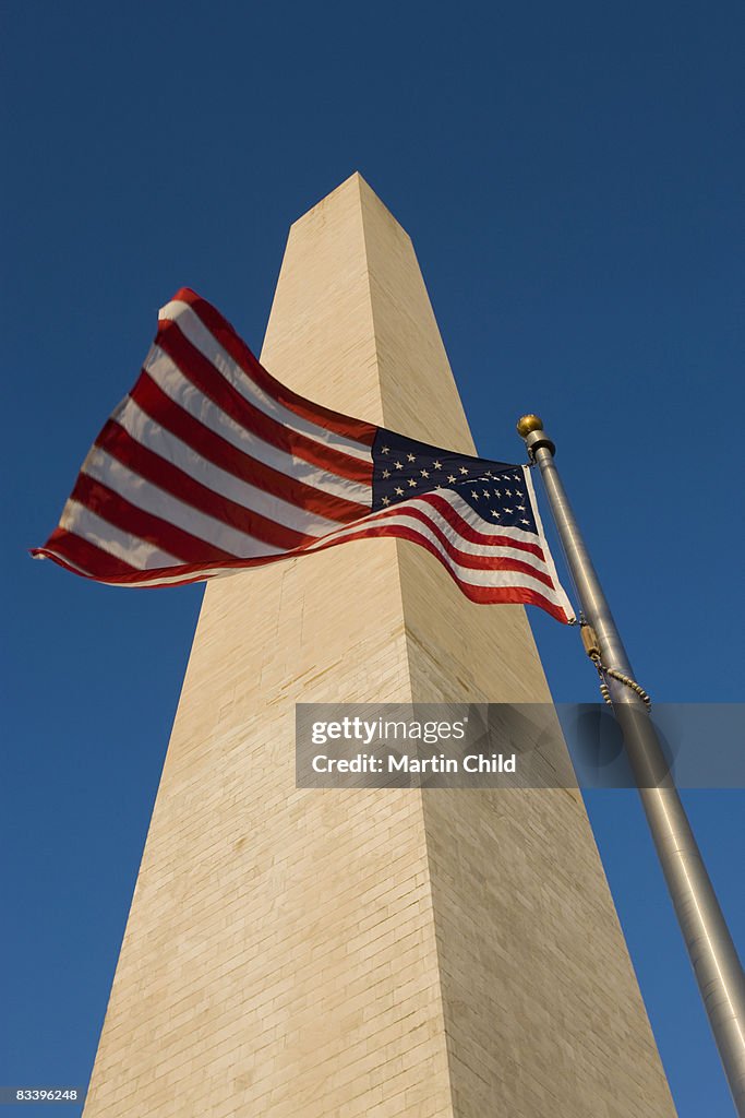 Washington Monument with flag in front