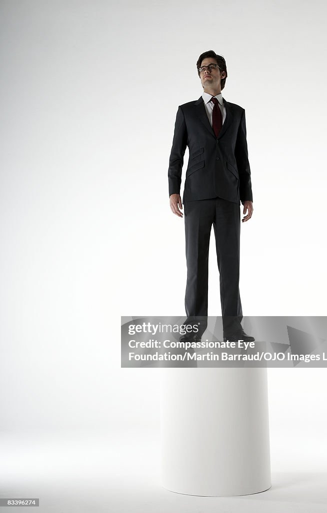Man standing proud on a podium