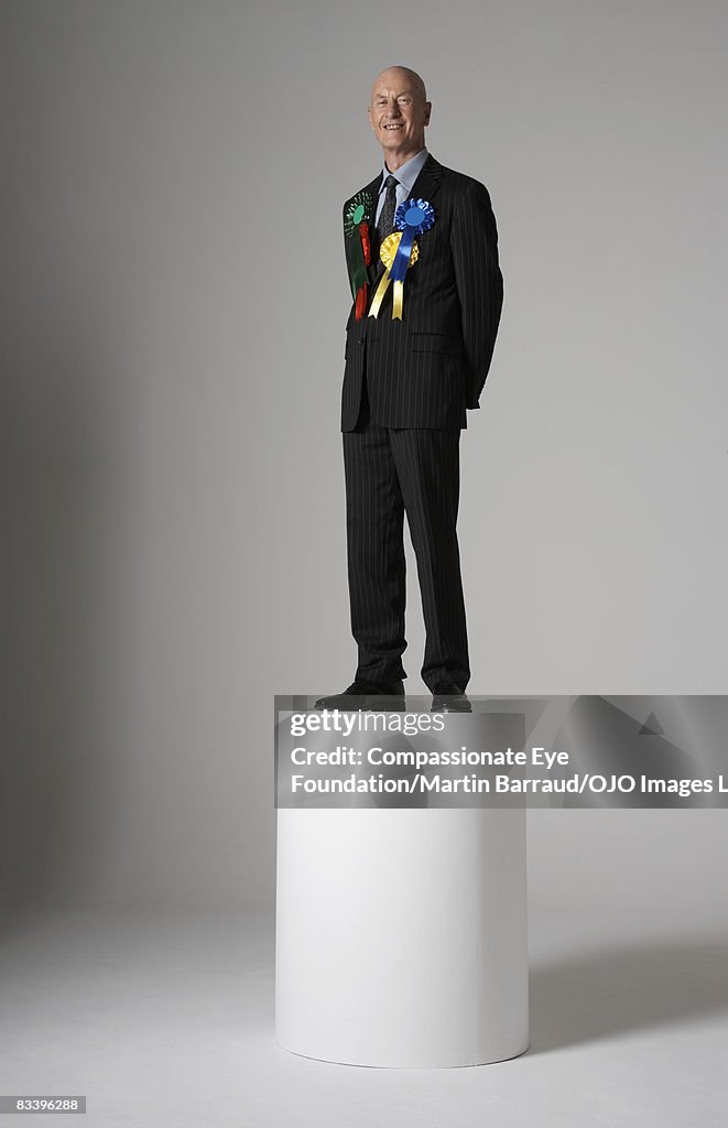 Man With Ribbon Man Standing On A Pedestal Wearing Many Ribbons High-Res Stock Photo ...