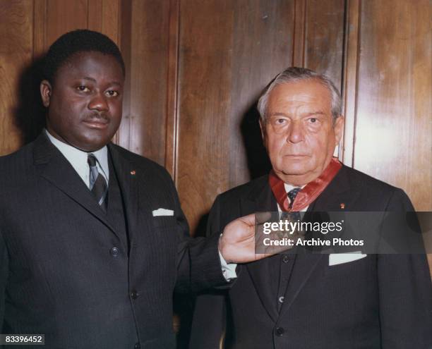 American jeweller Harry Winston is created a knight of the National Order of the Republic of the Ivory Coast by Ivoirian politician Henri Konan...