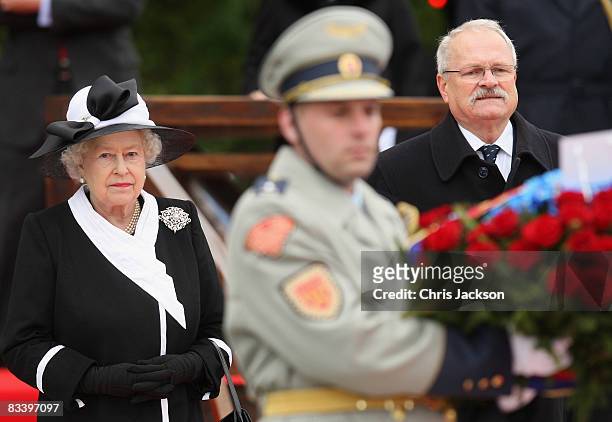 Queen Elizabeth II and President Ivan Gasparovic take part in a wreath laying at Devlin Castle on the first day of a tour of Slovakia on October 23,...