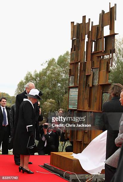 Queen Elizabeth II and President Ivan Gasparovic unveil an Iron Curtain Memorial after taking part in a wreath laying at Devlin Castle on the first...