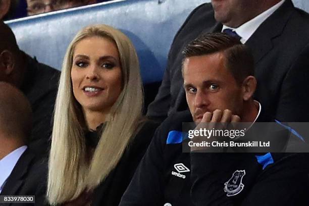 Gylfi Sigurdsson of Everton watches the match with partner Alexandra Ivarsdottir during the UEFA Europa League Qualifying Play-Offs round first leg...