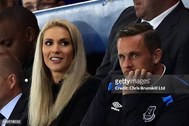 Gylfi Sigurdsson of Everton watches the match with partner Alexandra Ivarsdottir during the UEFA Europa League Qualifying Play-Offs round first leg...