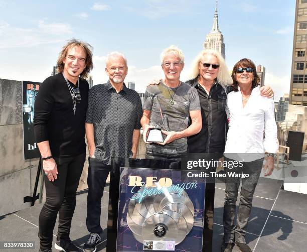 Dave Amato, Neal Doughty, Kevin Cronin, Bruce Hall and Bryan Hitt of REO Speedwagon attend REO Speedwagon Receives RIAA Diamond Award For "Hi...