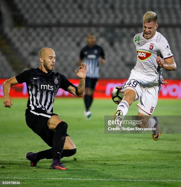 Krisztian Geresi of Videoton in action against Nemanja Miletic of Partizan during the UEFA Europa League Qualifying Play-Offs round first leg match...