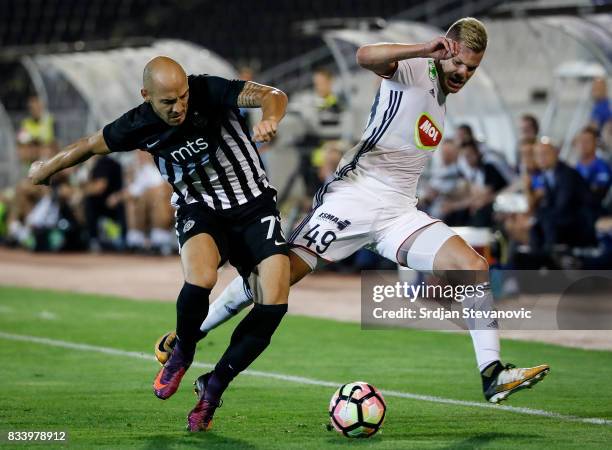 Krisztian Geresi of Videoton in action against Nemanja Miletic of Partizan during the UEFA Europa League Qualifying Play-Offs round first leg match...