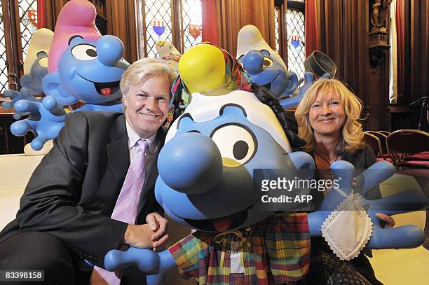 Thierry and Veronique Culliford, son and daughter of Peyo , pose with Smurfs that were painted and decorated by several artists from all over Europe,...