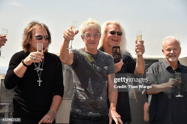 Dave Amato, Kevin Cronin, Bryan Hitt and Neal Doughty attend REO Speedwagon Receives RIAA Diamond Award For "Hi Infidelity" at Sony Music on August...