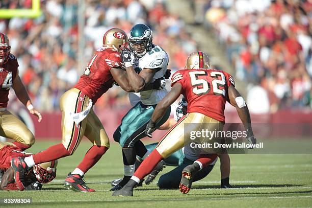 Running back Correll Buckhalter of the Philadelphia Eagles gets hit by linebacker Takeo Spikes of the San Francisco 49ers on October 12, 2008 at...