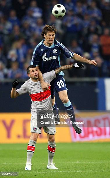 Mateja Kezman of Paris Saint-Gerrmain and Mladen Krstajic of Schalke go up for a header during the UEFA Cup match between FC Schalke 04 and Paris...