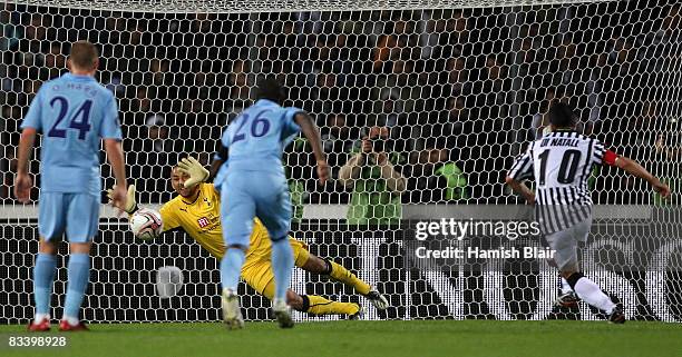 Heurelho Gomes of Tottenham is unable to stop the penalty from Antonio Di Natale of Udinese during the UEFA Cup Group D match between Udinese and...