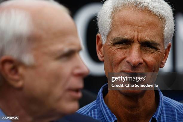 Republican presidential nominee Sen. John McCain makes a statement to the news media with Florida Governor Charlie Crist after having lunch with...