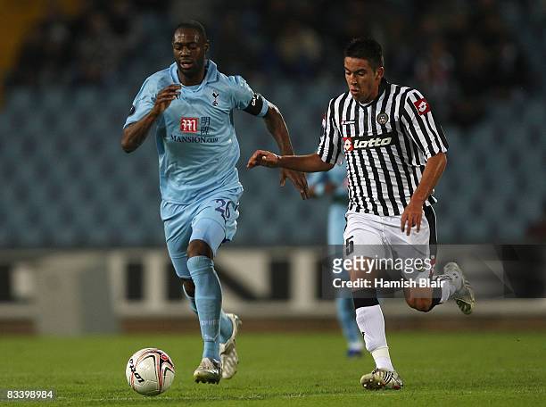 Ledley King of Tottenham contests with Mauricio Isla of Udinese during the UEFA Cup Group D match between Udinese and Tottenham Hotspur at the Stadio...