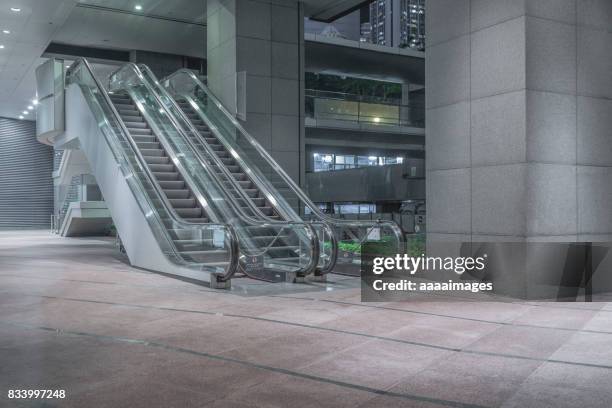 empty escalator outdoors - shopping centre escalator stock pictures, royalty-free photos & images