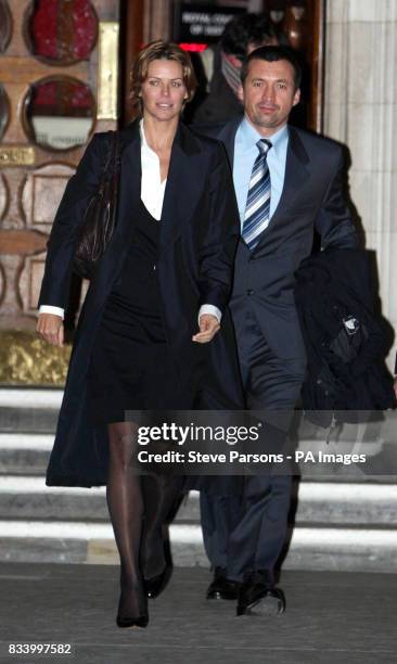 Former girlfriend of Dodi Fayed, Kelly Fisher, leaves the High court in London with an unidentified man after giving evidence for the inquest into...