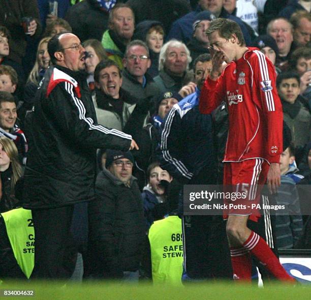 Liverpool's Peter Crouch is dismissed by referee Martin Atkinson