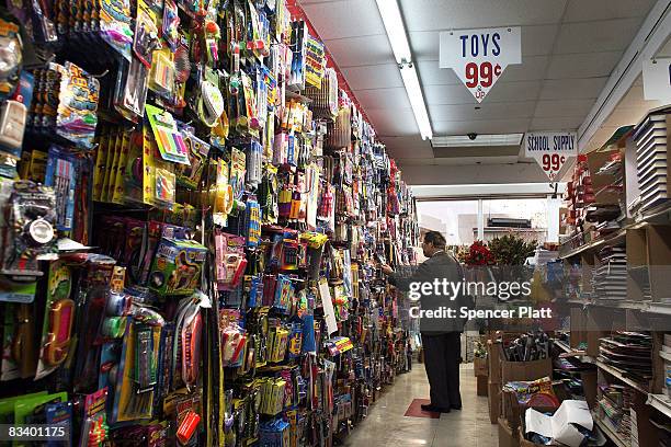 People shop at a 99 cent store October 23, 2008 in Brooklyn, New York. New government report by the Labor Department showed that the number of U.S....