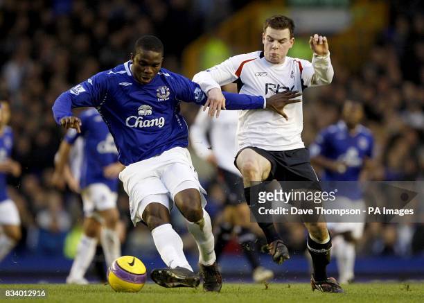 Bolton Wanderer's Danny Guthrie and Everton's Joseph Yobo battle for the ball.