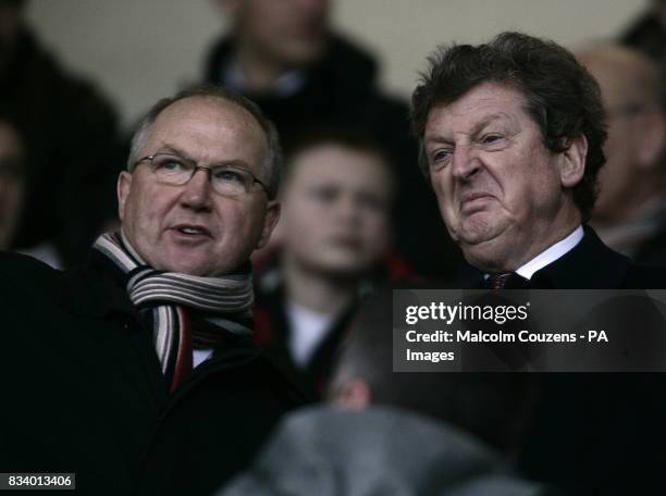 Newly appointed Fulham manager Roy Hodgson watches his new team from the stands with assistant manager Les Reed