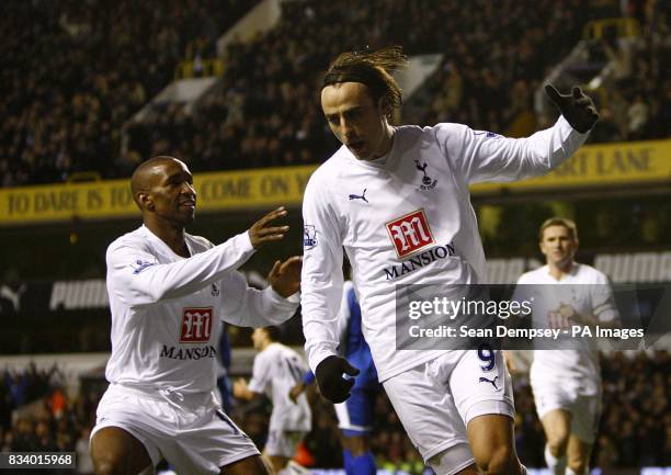 Tottenham Hotspur's Dimitar Berbatov celebrates scoring his sides second goal of the match with teammate Jermain Defoe