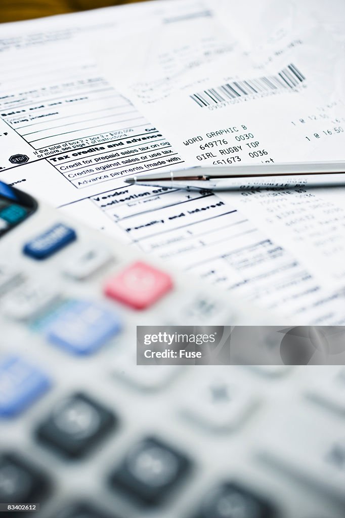 Tax Forms with Calculator and Pen
