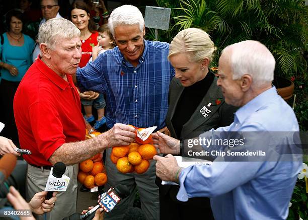 Parksdale Farms co-owner Jim Meeks delivers bags of oranges to Republican presidential nominee Sen. John McCain and his wife Cindy McCain as Florida...