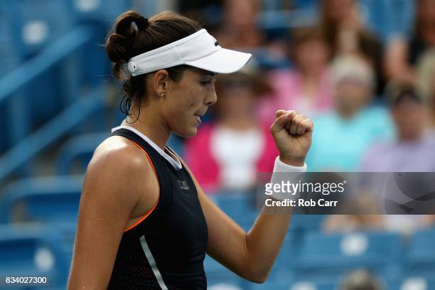 Garbine Muguruza of Spain celebrates match point after defeating Madison Keys during Day 6 of the Western and Southern Open at the Linder Family...