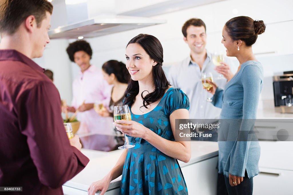 Guests in Kitchen at Dinner Party