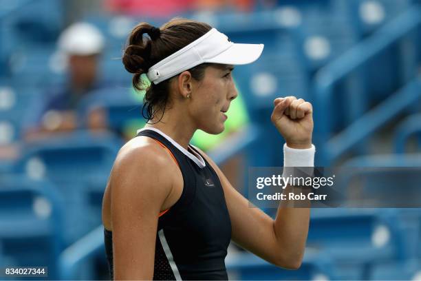 Garbine Muguruza of Spain celebrates match point after defeating Madison Keys during Day 6 of the Western and Southern Open at the Linder Family...