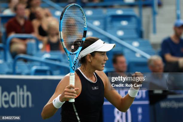 Garbine Muguruza of Spain celebrates match point after defeating Madison Keys during Day 6 of the Western and Southern Open at the Linder Family...