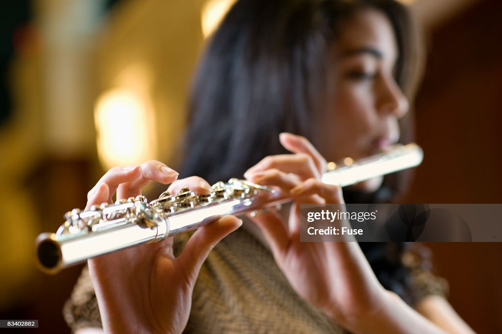 Woman Playing Flute
