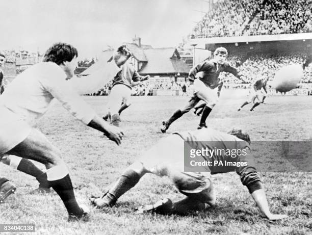 England scrum half Youngs whips the ball out over his irish opposite number McGrath as Fergus Slattery runs in to try to intercept at Lansdowne road....