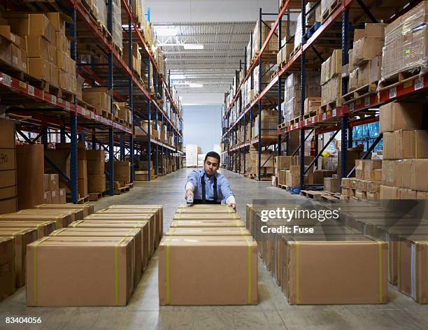 man working in warehouse - fuse box stockfoto's en -beelden