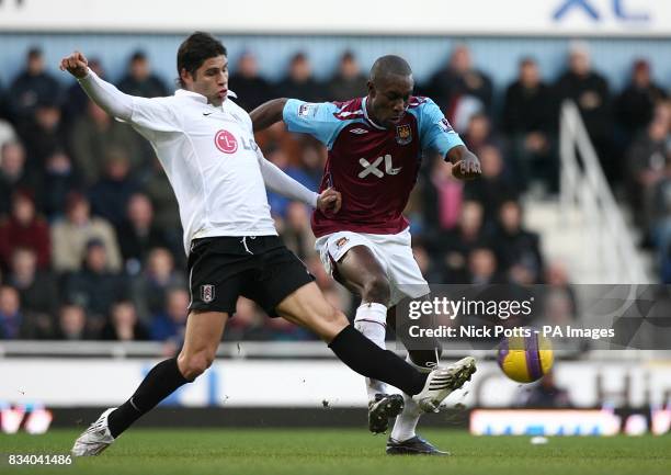 Carlton Cole, West Ham United and Dejan Stefanovic, Fulham battle for the ball