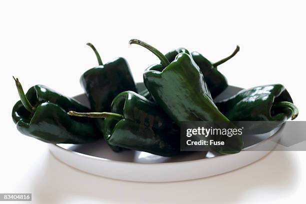 bowl of ancho peppers - ancho stock-fotos und bilder