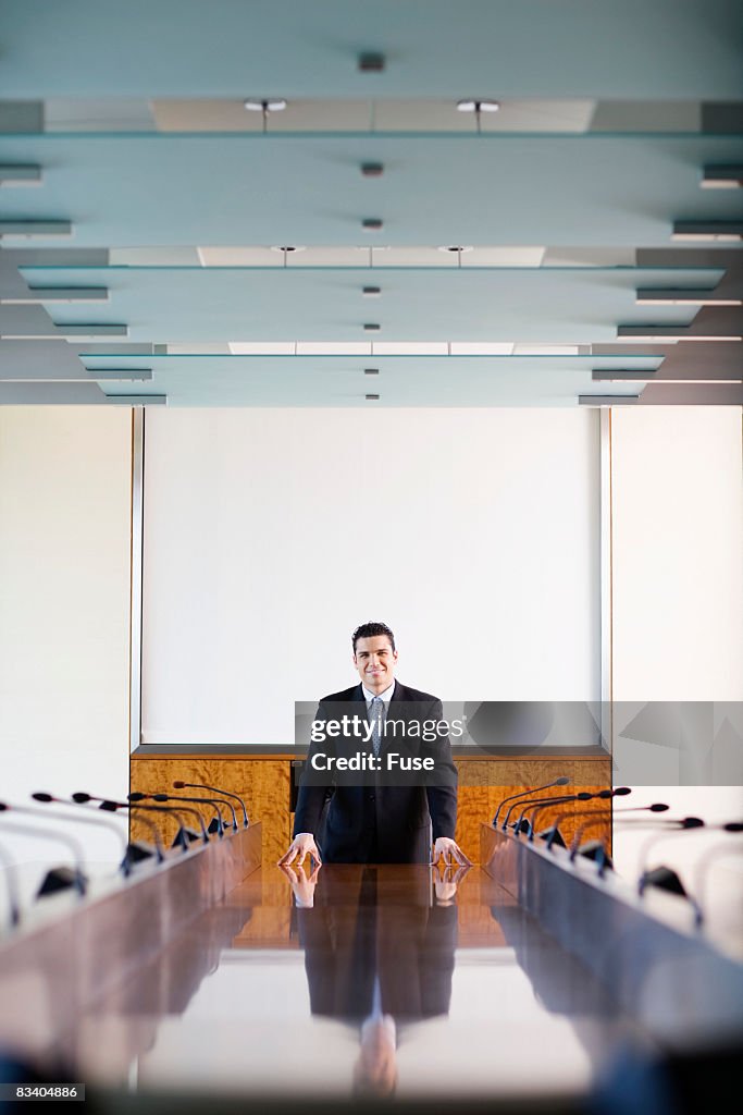 Businessman at Conference Room Table
