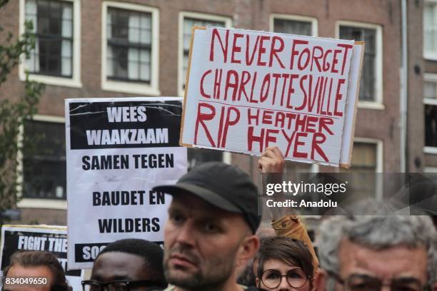 Demonstrator holds a banner reading " Never Forget Charlottesville RIP Heather Heyer" during a protest called by the Dutch Antifascist Action AFA...