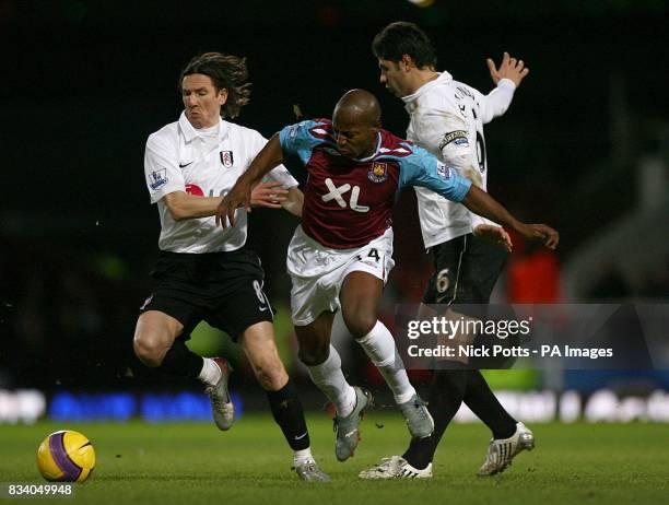 West Ham United's Luis Boa Morte battle for the ball with Fulham's Alexey Smertin and Dejan Stefanovic.