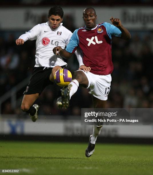 Carlton Cole, West Ham United and Dejan Stefanovic, Fulham battle for the ball