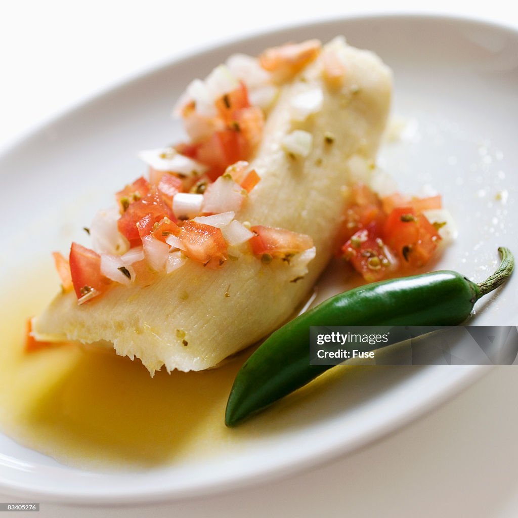 Tamale and Chili Pepper on Plate