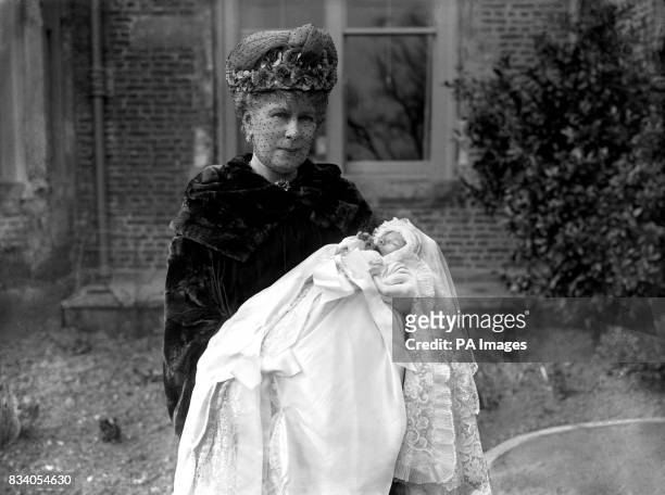 Queen Mary with her baby grandson, George Lascelles, later to be the 7th Earl of Harewood, the son of Mary, the Princess Royal, at his Christening in...